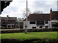 Looking across from Tillington Churchyard to The Horse Guards Inn