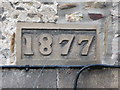 NY9864 : Date stone on the Victorian cottages at the north end of the bridge by Mike Quinn
