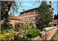 Tall House with Tulips