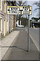 An old style road sign at Langholm