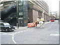 Mounted policemen heading towards The Barbican