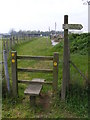 TM0837 : Stile on the footpath at Cotswold Poultry Farm by Geographer