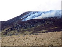NN8439 : Heather burning, Glen Quaich by Maigheach-gheal