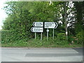 Road signs at junction of Mapleton Road and Pootings Road, Four Elms