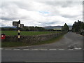 A Grantown road junction with an old signpost