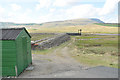 Sluice gate and control building in the upper Spey valley