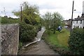 Flowing past the houses