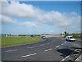 J0510 : Entering the Ballymascanlan roundabout from the direction of the M1 by Eric Jones
