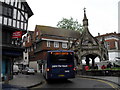 Bus passing the Market Cross