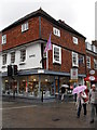 Umbrellas up passing Crane Street