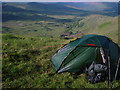 V8860 : Cosy camp below north side of ridge. by Keith Cunneen