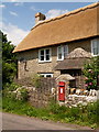 Bishop?s Caundle: thatched cottage at Poll Bridge