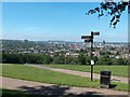 Signpost in Meersbrook Park with a panoramic view of Sheffield beyond