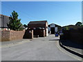 Rear entrance to "asphaltic roofing supplies" in Stakes Road