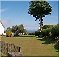 Garden in Ffordd y Glyn with a view across the sea to the hills of Meirionnydd