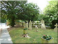 Flower boxes in the churchyard at St John the Apostle, Marchwood