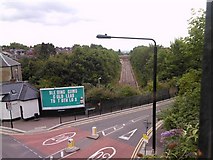 TQ3087 : Road and rail, viewed from Parkland Walk by Robert Lamb