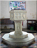 TM1596 : St Nicholas' church in Fundenhall - baptismal font by Evelyn Simak