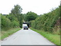 Descent into dip under low railway bridge, Saxham