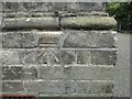 Bench mark on the Oulton Broad Library