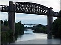 SJ6387 : Disused railway bridge over Manchester Ship Canal by David Martin