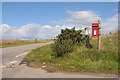 NH6262 : Postbox at the road end to Kinbeachie by Steven Brown