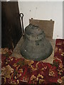 St Peter, Charsfield- bell in the church porch