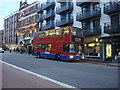 TQ2583 : A route 98 bus stopping on Kilburn high Road by Oxyman