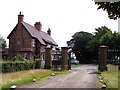 The lodge and gates at entrance to the coach road