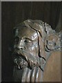 NY7863 : St. Cuthbert's Church, Beltingham - carved head on choir stall by Mike Quinn
