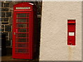 SM9637 : Fishguard: postbox № SA65 14 and phone, Quay Street by Chris Downer