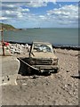 Abandoned Car tethered to the Nigg Breakwater