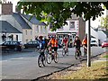 Cyclists in the main street of Town Yetholm