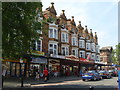 Splendid terrace of shops and dwellings, Torbay Road, Paignton