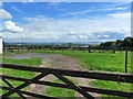 Gates, a field, and a stunning view