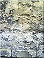 Worn benchmark on wall of Bulwarks Lane