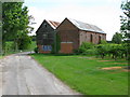 Farm buildings on track to Woolton Farm