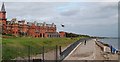 J3831 : Mind your head.. a helicopter leaves the Slieve Donard Hotel helipad by Eric Jones