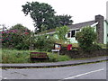 Postbox and seat on corner of Meadow Park, Treffgarne, Pembrokeshire