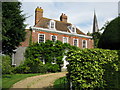 Delbridge House and the spire of Wingham church