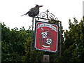 Bird sculpture on a pub sign in Burwarton village