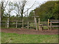 Stile and signpost at footpath junction