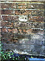 Benchmark on wall of Wollaston Road