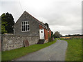 Outbuildings beside the church