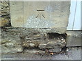 Benchmark on arch of side gate to #87 London Street