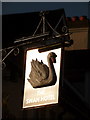 Arundel: the sun reflects off the Swan Hotel sign