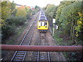 Train from Llandaff about to pass under Llys Tal-y-Bont Rd, Cardiff