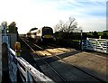SK7918 : Train to Stansted approaching Wyfordby level crossing by Andrew Tatlow