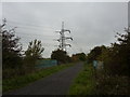 Dismantled railway line and pylons