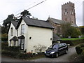 Cottage and church, Huish Champflower